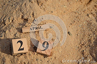 April 29, Number cube with Sand background. Stock Photo