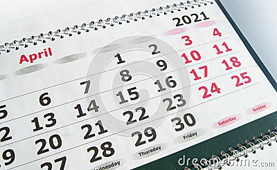 April 2021 paper calendar planner with spiral, close-up Stock Photo