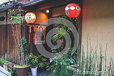 10 April 2012 Red lantern illuminates entryway on Japanese street Editorial Stock Photo