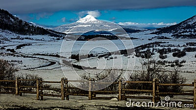 APRIL 27, 2017 RIDGWAY COLORADO -Hastings Mesa shows Volcanic Mountain and rail fence in the San. Day, Volcano Stock Photo