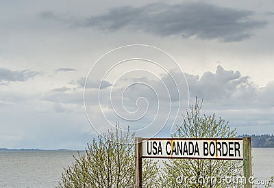 April 14, 2019 - Surrey, British Columbia: BNRR Railway USA Canada border sign. Editorial Stock Photo