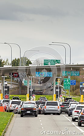 April 14, 2019 - Surrey, Canada: USA bound vehicles waiting at Peace Arch border inspection station near Blaine, WA. Editorial Stock Photo