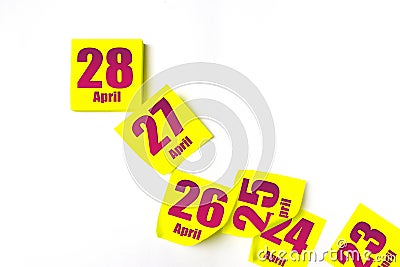 April 28th. Day 28 of month, Calendar date. Many yellow sheet of the calendar. Spring month, day of the year concept Stock Photo