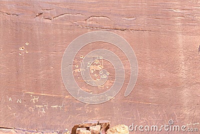 Fragment of surviving rock inscriptions left over from ancient times on a rock in the Wadi Rum desert near Aqaba city in Jordan Editorial Stock Photo