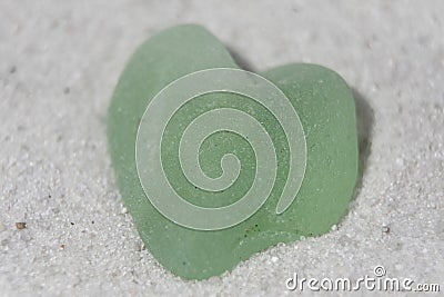 Aqua Sea Glass on a White Sand Beach Stock Photo