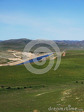 Aquaduct running through the central valley of California Stock Photo