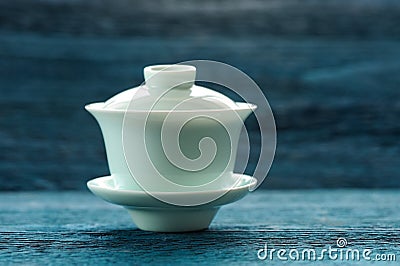 Aquamarine gaiwan on blue background Stock Photo