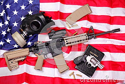 AR Rifle, a Bible, a Gas Mask & a Pistol on Americ Stock Photo