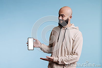 Arab advertiser presenting smartphone Stock Photo