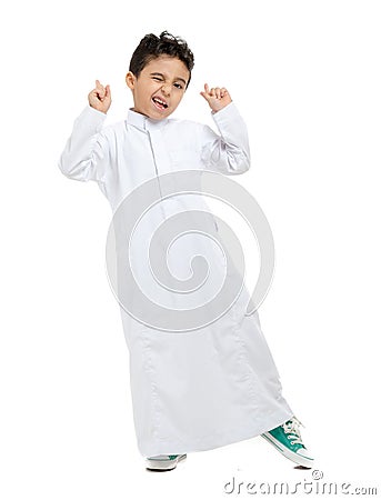 Arab boy smiling, winking and raising his hands Stock Photo