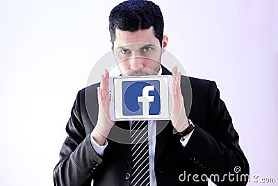 Arab business man with facebook logo Editorial Stock Photo