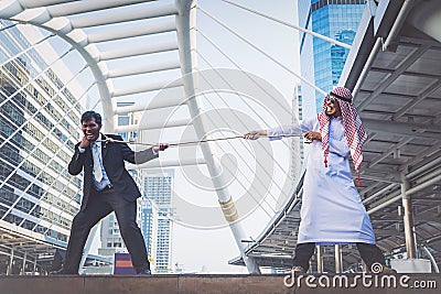 Arab businessman Pull the rope. Stock Photo