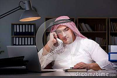 The arab businessman working late in office Stock Photo