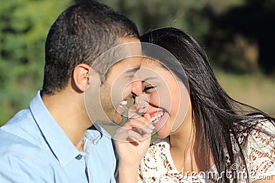 Arab casual couple man and woman flirting and laughing happy in a park Stock Photo