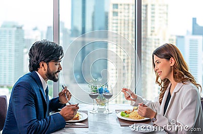 Arab couple lover dating and take a linch in Italian restaurant Stock Photo