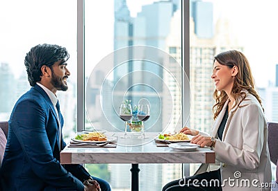 Arab couple lover dating and take a linch in Italian restaurant Stock Photo