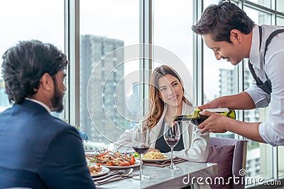 Arab couple lover dating and take a linch in Italian restaurant Stock Photo