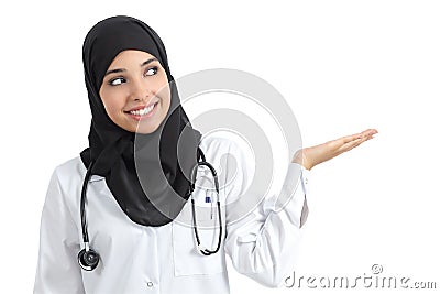 Arab doctor woman presenting with palm up Stock Photo