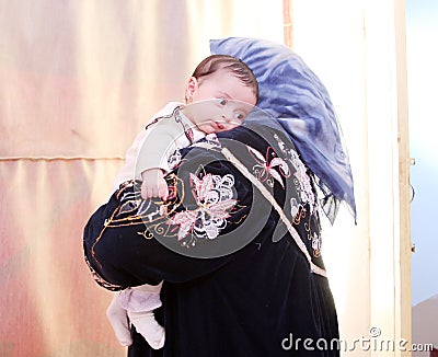 Arab egyptian newborn baby girl with grandmother Stock Photo