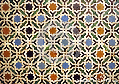 Arab geometric mosaic of Alhambra in Granada, Spain. Stock Photo