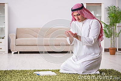 The arab man praying at home Stock Photo