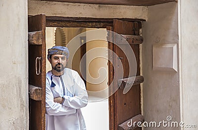 Arab man in traditional omani outfit in an old castle Stock Photo