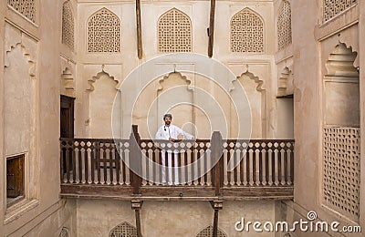 Arab man in traditional omani outfit in an old castle Stock Photo