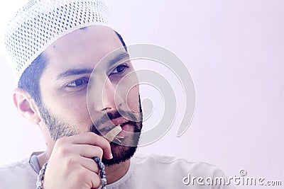 Arab muslim man with toothbrush miswak Stock Photo