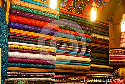 Arab store selling a variety of fabrics, Fabric in rolls Stock Photo
