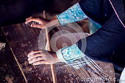 Arab woman makes bread in beduin village in Egypt Stock Photo