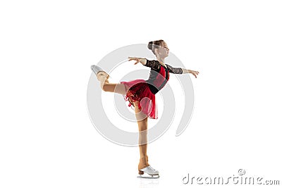 Portrait of little flexible girl, figure skater wearing stage attire posing isolated on white studio backgound. Concept Stock Photo