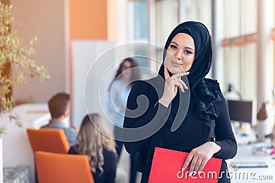 Arabian business woman with hijab holding a folder Stock Photo