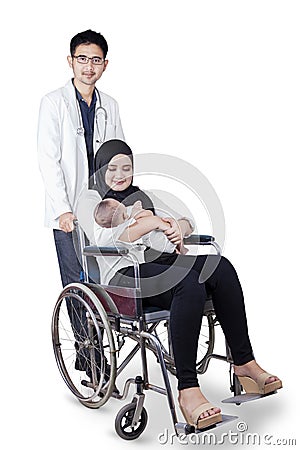 Arabian doctor with patient and her baby Stock Photo