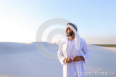 Arabian guy feels unpleasant sensations with cold, standing in m Stock Photo