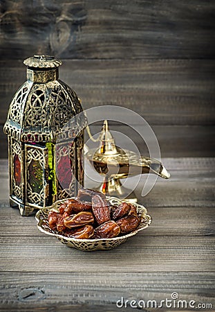 Arabian lantern, golden lamp, fruits. Ramadan kareem Stock Photo