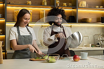 Arabian man chef teaches woman to cook traditional dish Stock Photo