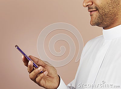Arabian man watching social media in smart phone Stock Photo