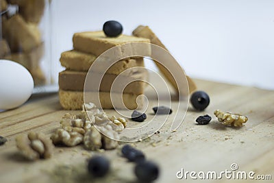 Arabian Mediterranean food ingredient egg, teac, rusk biscuit, black olives, walnut, zaatar, thyme, raisins on wooden platter Stock Photo