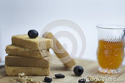 Arabian Mediterranean food ingredient egg, teac, rusk biscuit, black olives, walnut, zaatar, thyme, raisins on wooden platter Stock Photo