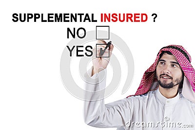 Arabian worker approving supplemental insured Stock Photo