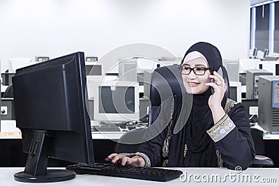 Arabian worker talking on the mobile phone Stock Photo