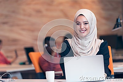 Arabic business woman wearing hijab,working in startup office. Stock Photo