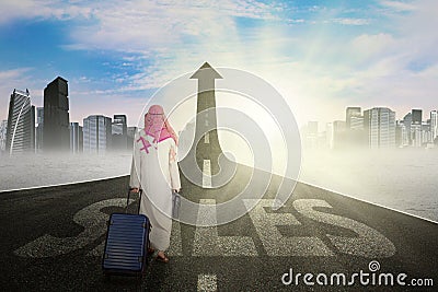 Arabic businessman with bag on the street Stock Photo