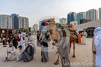 Arabic culture display - traditional cloth - Middle Eastern Culture - Emirati Men | tourist attraction activities Editorial Stock Photo