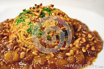 Arabic dish with couscous, vegetables and peach mango raisin sauce topped with parsley and pine nuts Stock Photo