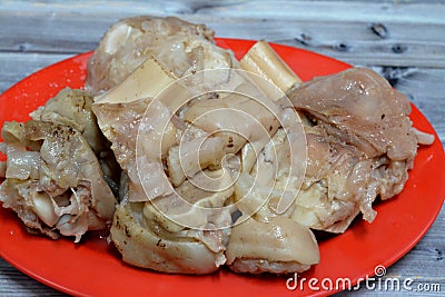 Arabic Egyptian cuisine of kawareh trotters and knee boiled with soup full of collagen and Gelatin, cooked cow feet and knees, Stock Photo