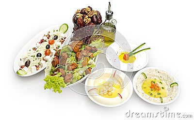 Arabic food of Hommos, Labneh, Fattoush, & Dates Stock Photo