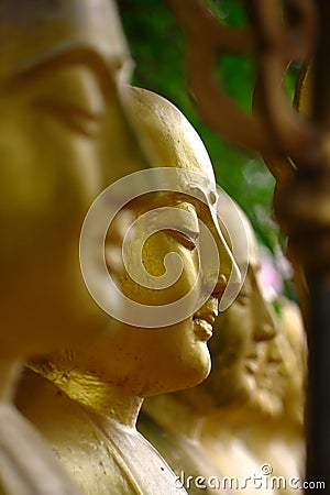 Arahant statues standing in a row. Stock Photo
