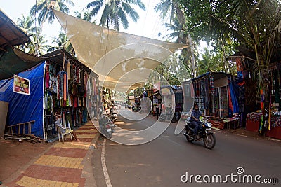 Arambol, Goa, Iindia - March 22, 2017: Street shops of sale of souvenirs and clothes for tourists in the Arambol village Editorial Stock Photo