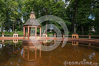 Arbor on the edge of the pond Editorial Stock Photo